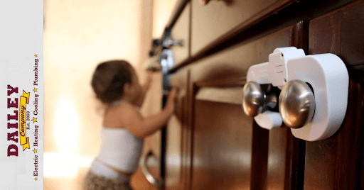 kid trying to open a cabinet